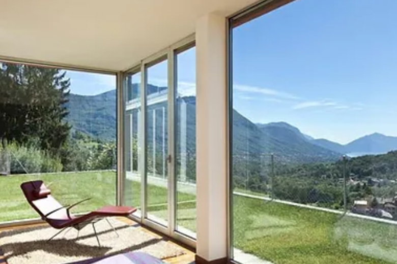 a chair situated behind several glass walls